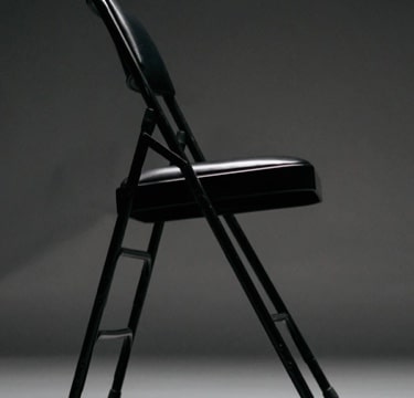 a black foldable chair